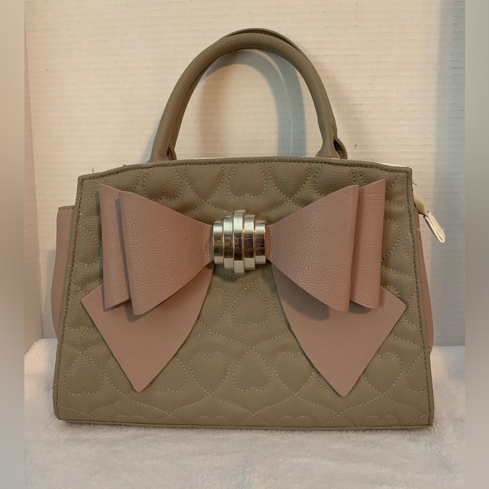 Betsey Johnson Handbag.  Mauve with soft pink bow. Used.  12” x 9”.